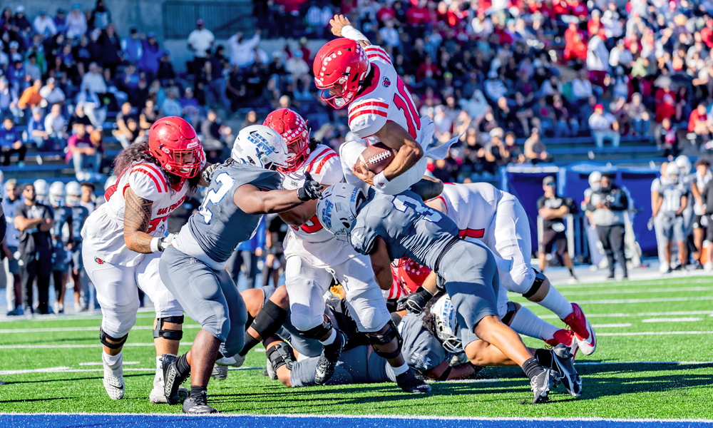 Dorian Hale dives in for a touchdown that was eventually called back after a CCSF penalty. (Photo by Eric Sun)