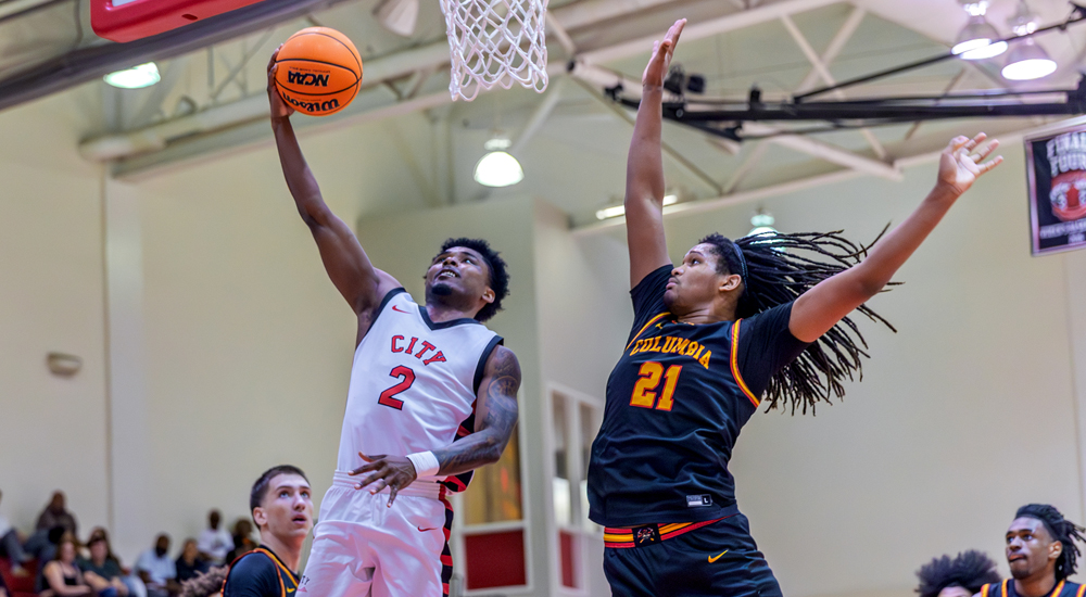 James Moore soars in for two points in the Rams' win over Columbia. (Photo by Eric Sun)