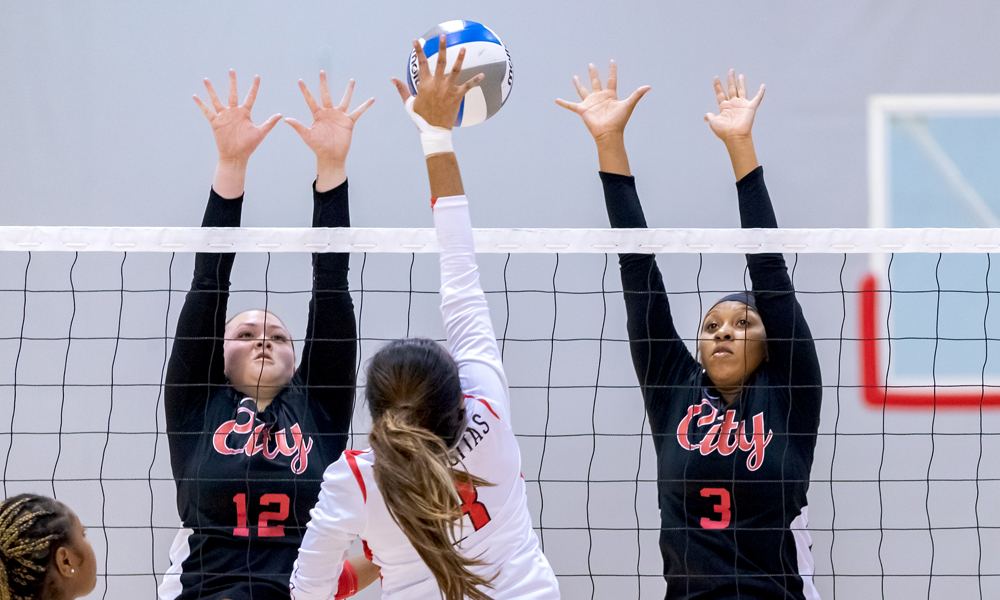 Katheryn Cheng and Keimaya Gates go up for a block in the win over Las Positas. (Photo by Eric Sun)